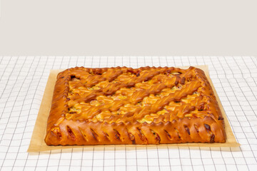 Yeast pie with filling - ham and cheese. rustic style. Russian cuisine. Homemade cakes.