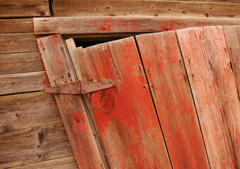 old wooden door hanging on hinges
