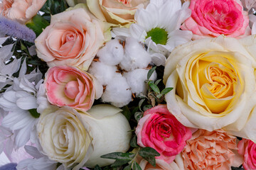 Gift box with beautiful flowers on white background