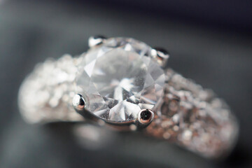 Diamond ring in jewelry gift box close up background
