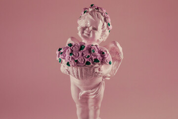 statue of angel with a bouquet of flowers