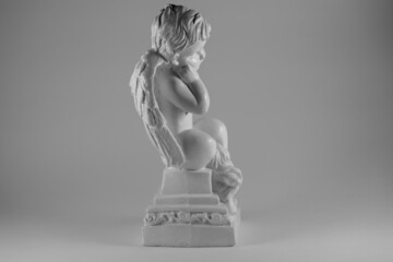 statue of angel in profile black and white