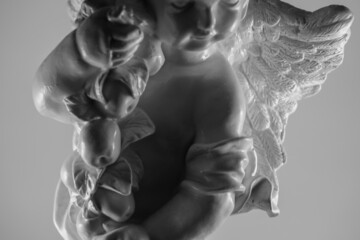 statue of angel arm black and white closeup