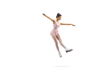 Full length shot of a professional female figure skater in a pink dress performing a jump