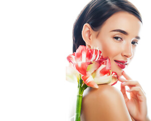 young pretty brunette real woman with red flower amaryllis isolated on white background close up
