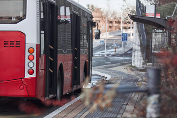 Public transportation bus in urban surroundings. © astrosystem