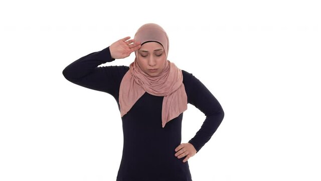 Exhausted muslim woman, wiping her forehead. Hard work concept. Isolated on a white background.