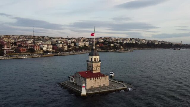 Drone rotation shot of Maiden's tower, also known as Leander's tower, located in Bosphorus strait separating the continents of Europe and Asia, city of Istanbul, Turkey.