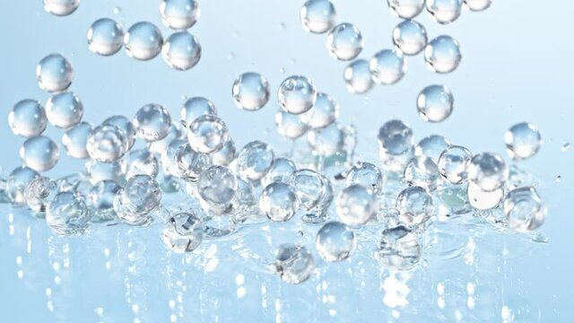 Super Slow motion Shot of Hydrogel Balls Bouncing on Glass at 1000fps.