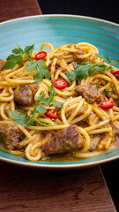 Peruvian pasta with meat cut with knife
