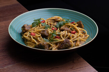 Peruvian pasta with meat cut with knife