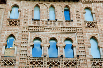 Vintage facade in moorish style with rounded windows and traditional arabic ornate also known as...