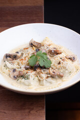 Raviol pasta with mashroom champignon sauce
