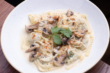 Raviol pasta with mashroom champignon sauce