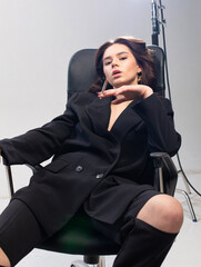 Obraz premium Sitting and smoking young european girl with white skin in office