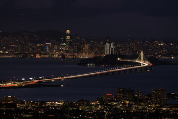 Fototapeta na wymiar San Francisco lit up the night with holidays lights via Berkeley Hills.