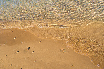 Fototapeta na wymiar Clean sandy beach with crystal clear sea water wave, Adriatic coast, Croatia
