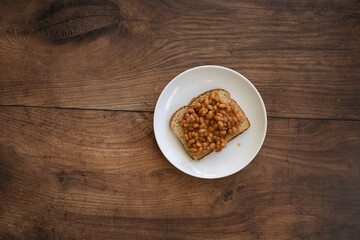 Beans on Toast on a Wooden Table with Room for Copy