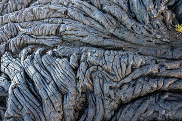 Lava background on Paradise Cliffs, Hilo, Big Island, Hawaii. The smooth, undulating surface of...