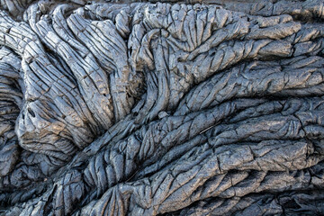 Lava background on Paradise Cliffs, Hilo, Big Island, Hawaii. The smooth, undulating surface of...