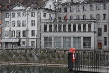 Heavy rain falling down in the city center of Lucerne. The streets are empty because of bad...