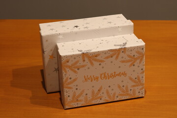 Christmas presents, wrapped gifts on a gray background.