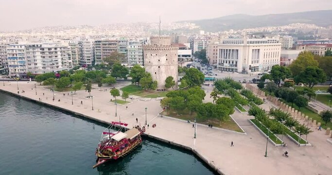 Video of a drone flying over the main symbol of Thessaloniki and the whole of Macedonia - the white tower. The concept of tourism in Greece and urban development.