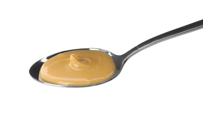 Spoon of delicious peanut butter on white background