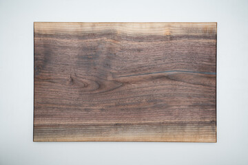 Beautiful walnut cutting board on a white background