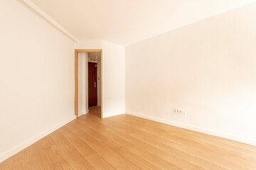 Fototapeta na wymiar Empty room with freshly painted walls and oak wood flooring