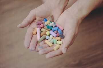 a lot of pencils in the hands of a woman artist