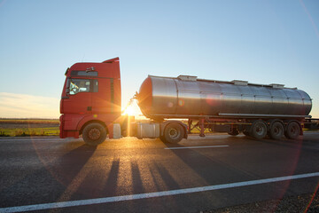 Petrol cargo truck driving on highway hauling oil products. Delivery transportation and logistics...