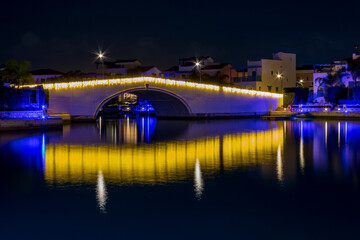 Fototapeta na wymiar Sea bay with bridge at night 