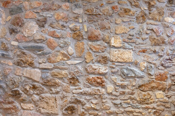 Stone wall texture background. Old stonewall traditional pattern building facade, natural material