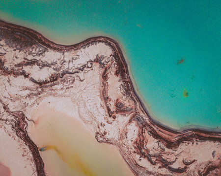 Aerial view of an abstract blue and turquoise clay lake, Art-sur-Meurthe, France.