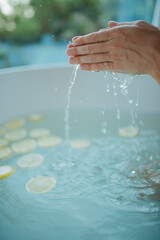 Naklejka na ściany i meble Taking bath with slices of the lemon