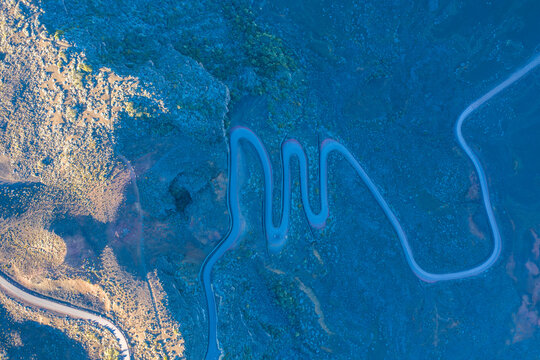 Aerial view of a serpentine road near Pas des Sables, Sainte Rose, Reunion.