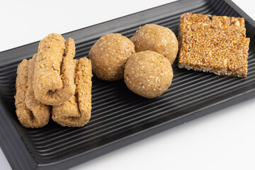 Indian traditional sweets for Makar Sankranti Or Lohri Mithai Gulab Gajak Also Known As Gur Gajjak, Gazak, Gachak Til Patti Or Papdi, Chikki Is Made Of Rose, Jaggery Gud, Almonds Badam And Pistachio