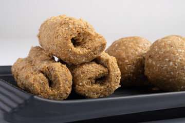 Indian traditional sweets for Makar Sankranti Or Lohri Mithai Gajak Also Known As Gur Gajjak, Gazak, Gachak Til Patti Or Papdi, Chikki Is Made Of Jaggery Gud, Almonds Badam And Pistachio