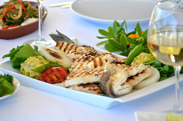 sliced sea bass with white wine and mezes
