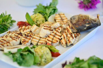 sliced sea bass with white wine and mezes
