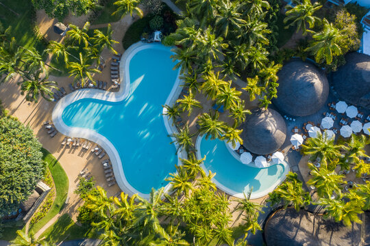 Aerial view of a small garden with swimming pool from a luxury resort in Pointe aux Canonniers, Mauritius.