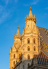 Fototapeta na wymiar Towers of St. Stephen's cathedral on Stephansplatz square in Vienna, Austria