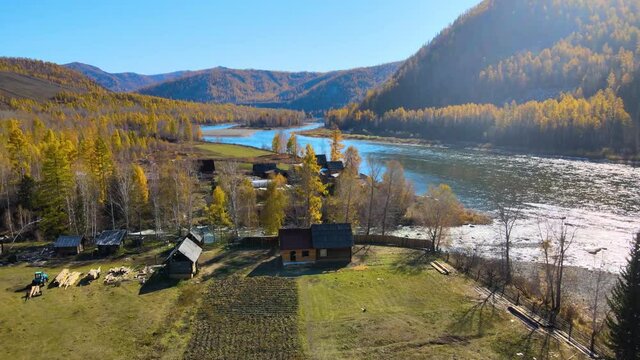 remote village on the bank of the river beautiful nature flying from a copter