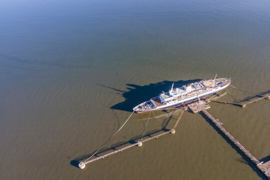 Aerial view of Cais da Matinha, a landmark ship docked along the Tagus river in Lisbon, Portugal.