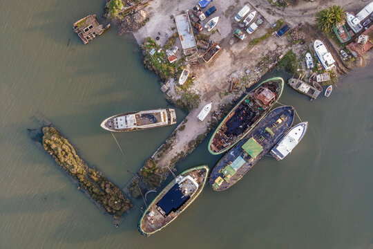 Aerial view of ship wrecks along the lagoon near Tagus river in Corroios, Setubal, Portugal.