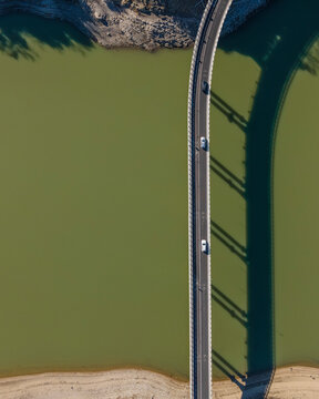 Aerial view of a road driving along the lake Corbara, Baschi, Umbria, Italy.