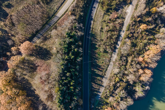 Aerial view of a road driving along the lake Corbara, Baschi, Umbria, Italy.