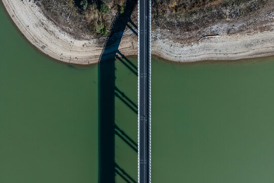 Aerial view of a road driving along the lake Corbara, Baschi, Umbria, Italy.