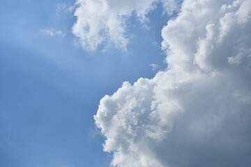 The blue sky had clouds blocking the sunlight during the day until the color of the shadows appeared.